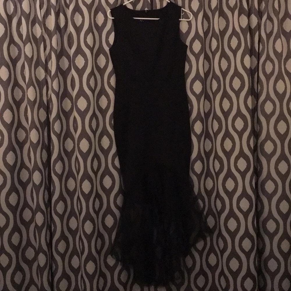 Black formal fitted dress.